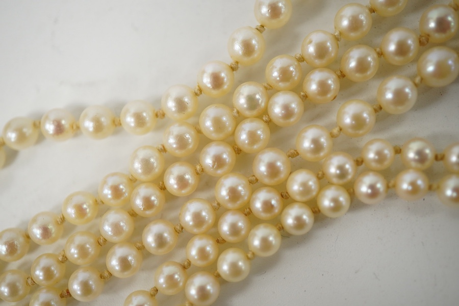 A double strand graduated culture pearl necklace, with marcasite set sterling clasp, 46cm and one other single strand cultured pearl necklace. Condition - fair